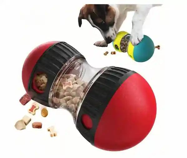 A red and black ball-shaped dog puzzle toy with a clear center section filled with treats, shown on a white background with a dog and treats in the upper right.