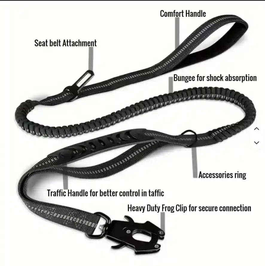 A black dog leash with multiple labeled callouts showing features such as seat belt attachment, comfort handle, bungee for shock absorption, accessories ring, traffic handle, and heavy duty frog clip, on a plain white background.