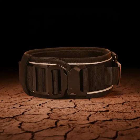 Black tactical dog collar with quick-release buckle and reflective strip on cracked red outback clay, Red Dirt Dogs Australia